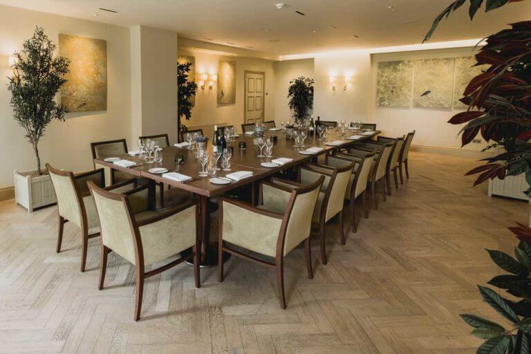 Room set up for conference with large table 