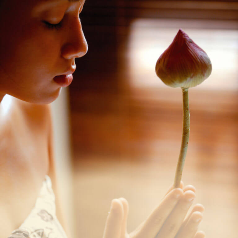 Girl holding a lotus flower