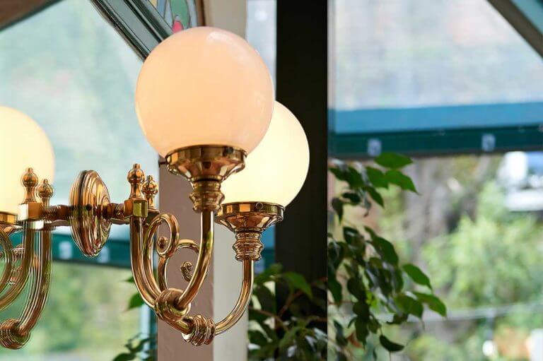 Detail shot of round lampshades in French restaurant Le Blaireau