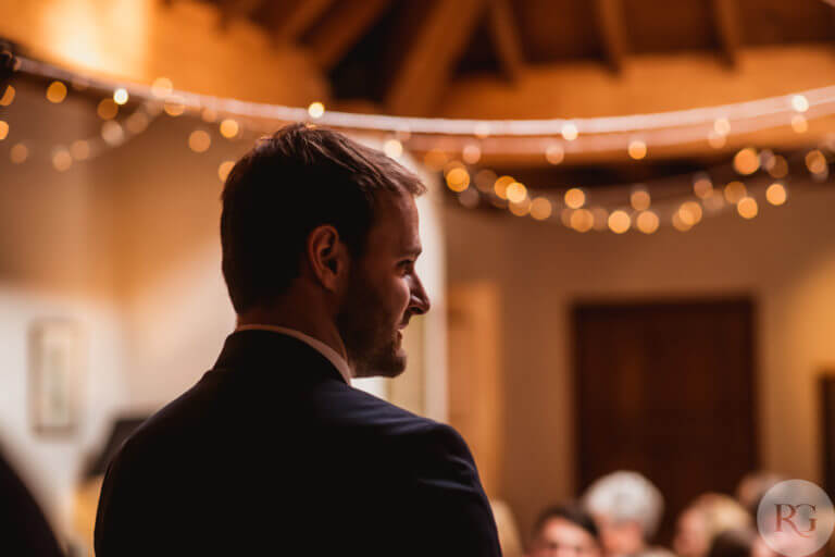 Close up of groom smiling at wedding ceremony 