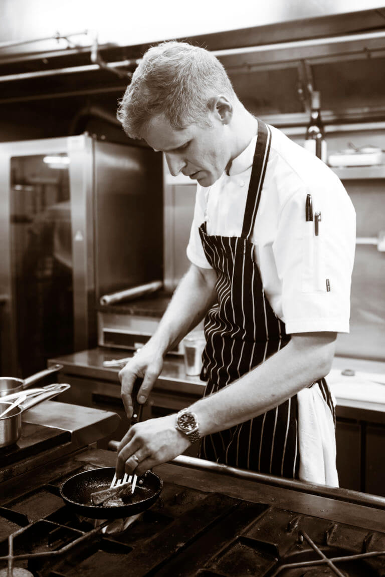 Head Chef Alistair Craig in the kitchen at Careys Manor Hotel & SenSpa
