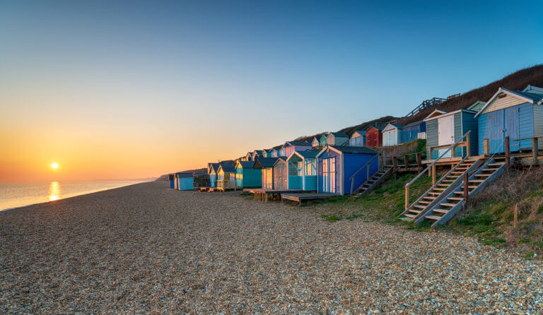 Rows Of Beach Huts At Milford On Sea