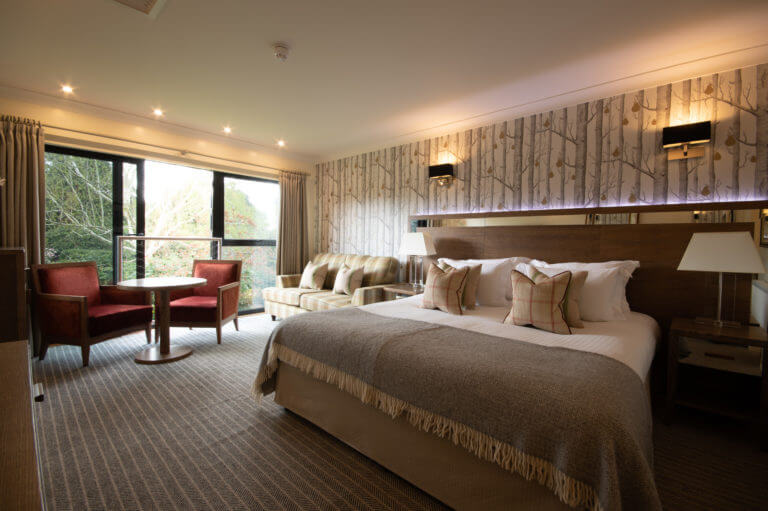 Bedroom with a Garden View at Careys Manor Hotel & SenSpa