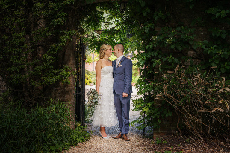 Wedding couple in the gardens at Careys Manor Hotel