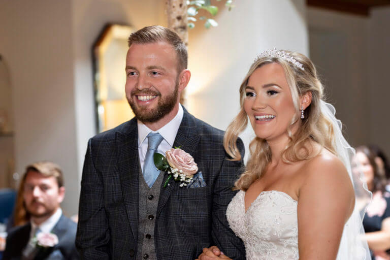 Wedding couple saying their vows at Careys Manor