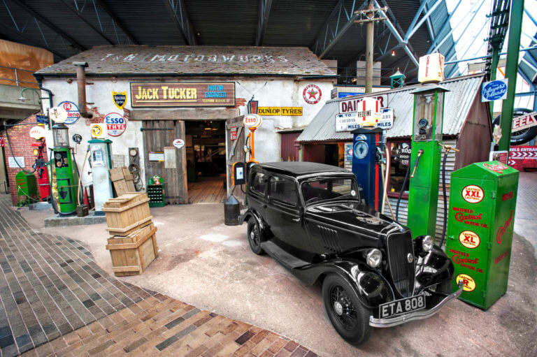 classic car and vintage garage display ay the National Motor museum Beaulieu