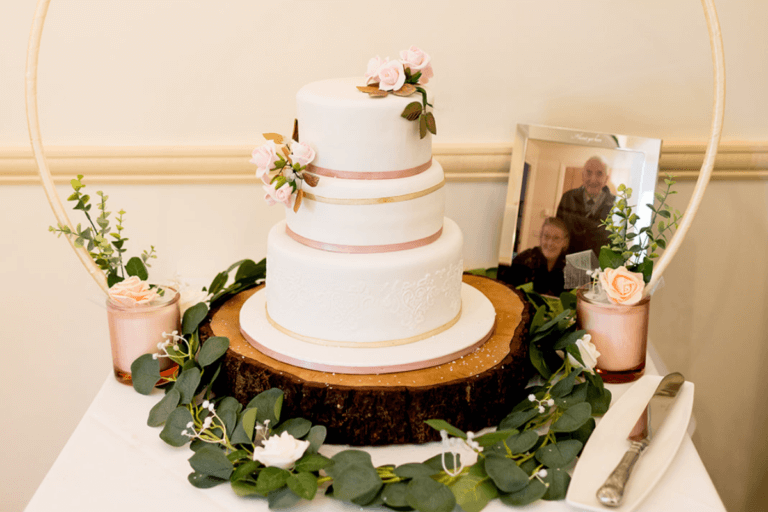 Hayley & Mikes wedding cake handmade by the brides mum at Hampshire wedding venue Careys Manor Hotel