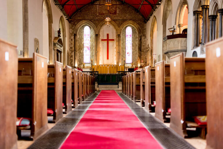 Church for wedding day with red carpet aisle
