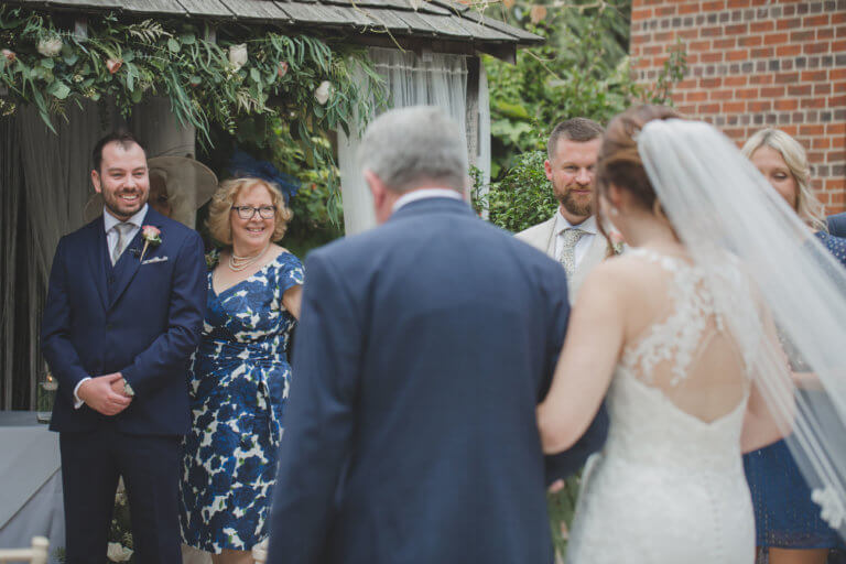 The Groom Ben waits for his bride at the alter at Hampshire wedding venue Careys Manor Hotel