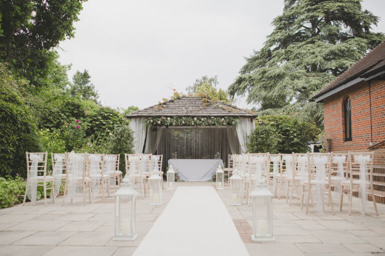 The Cedar Garden set for an outdoor wedding ceremony at Hampshire Wedding venue Careys Manor Hotel & SenSpa