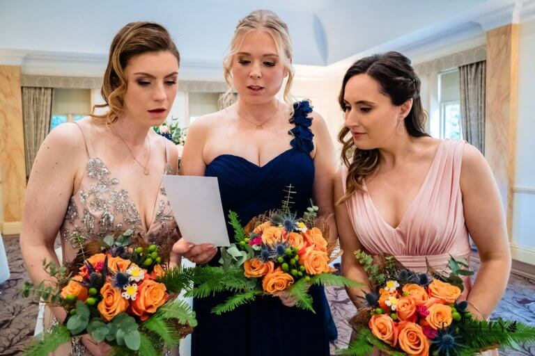 The Bridesmaids reading the order of service prior to the ceremony