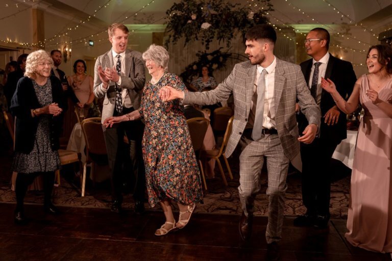 Guests dance at the wedding reception