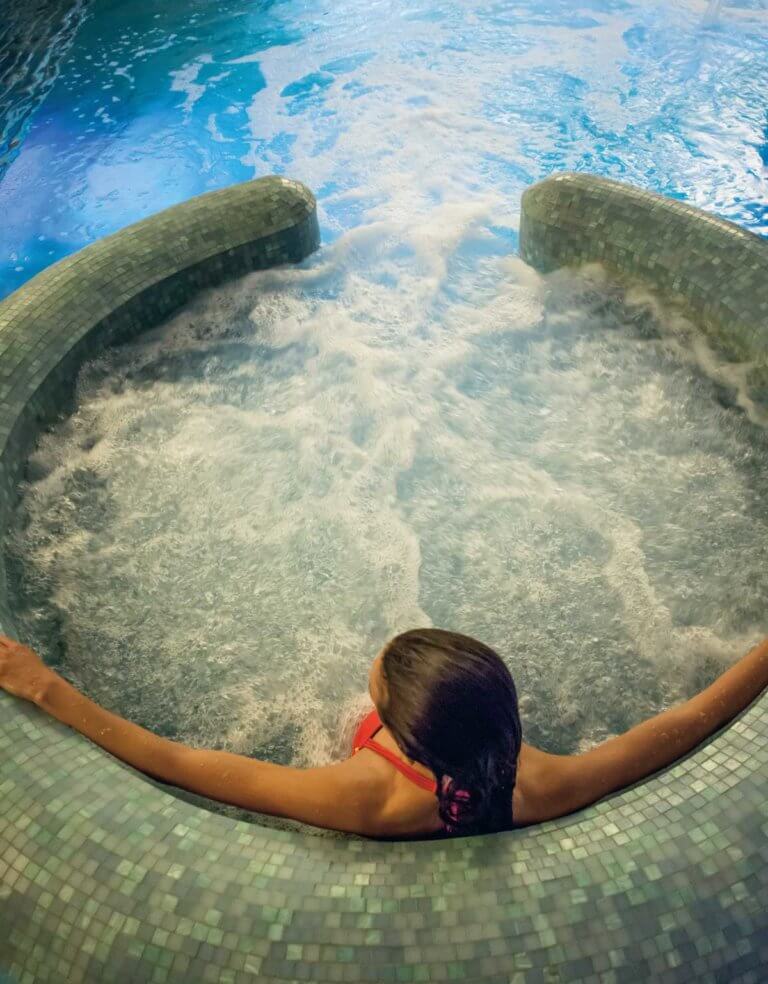 A female relaxing in the volcano pool within the spa facilities at SenSpa.