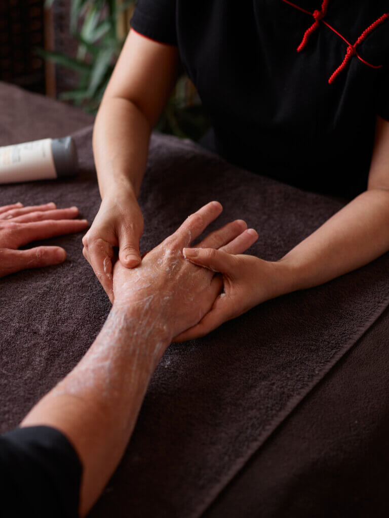 Man receiving hand grooming spa treatment