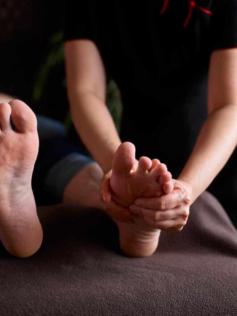 Man receiving spa foot treatment and massage
