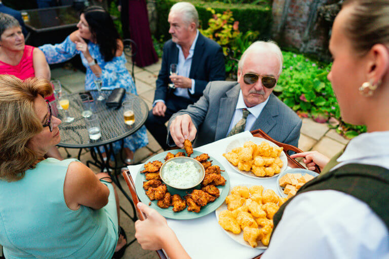 Guests enjoy drinks and canapes