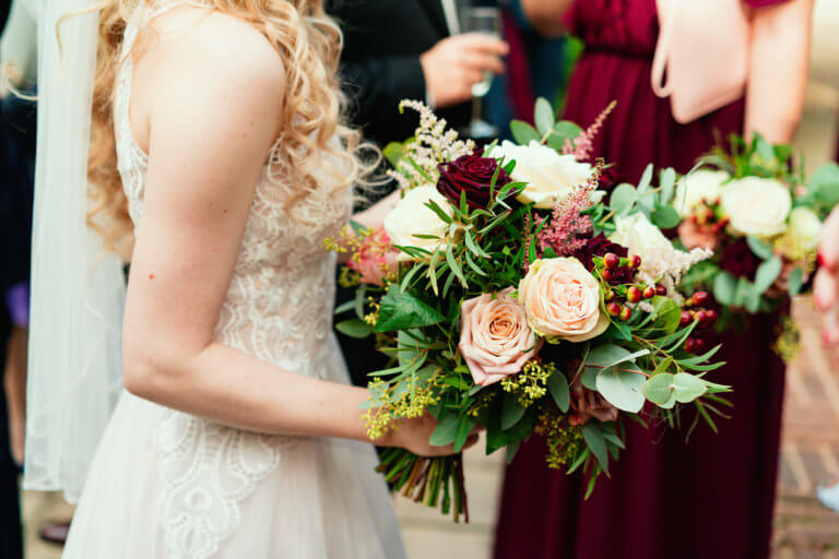 Brides bouquet being held her by the bride