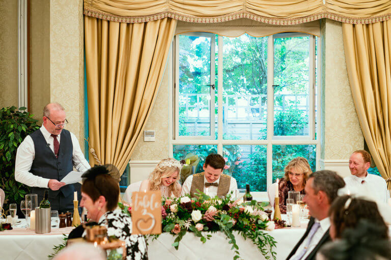 The top table laugh during the father of the bride speech