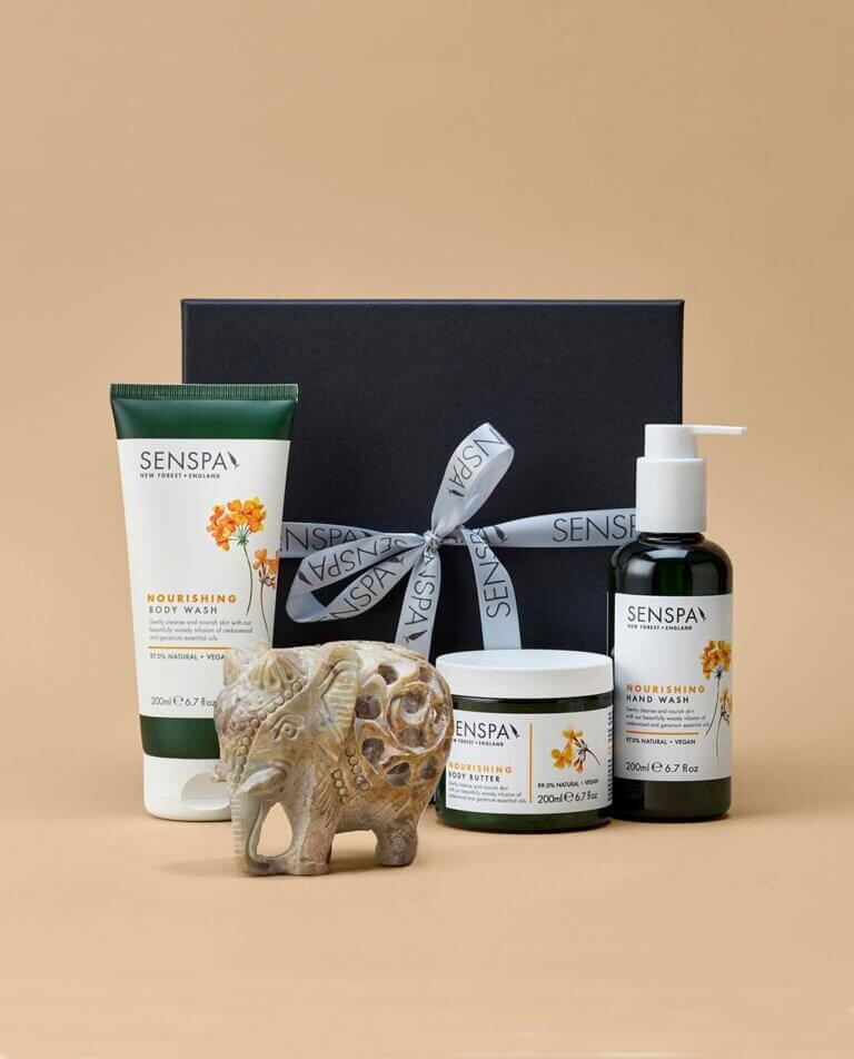 Product shot of Nourish gift box and its contents on cream background