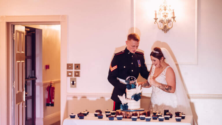 The bride & groom cut the cake