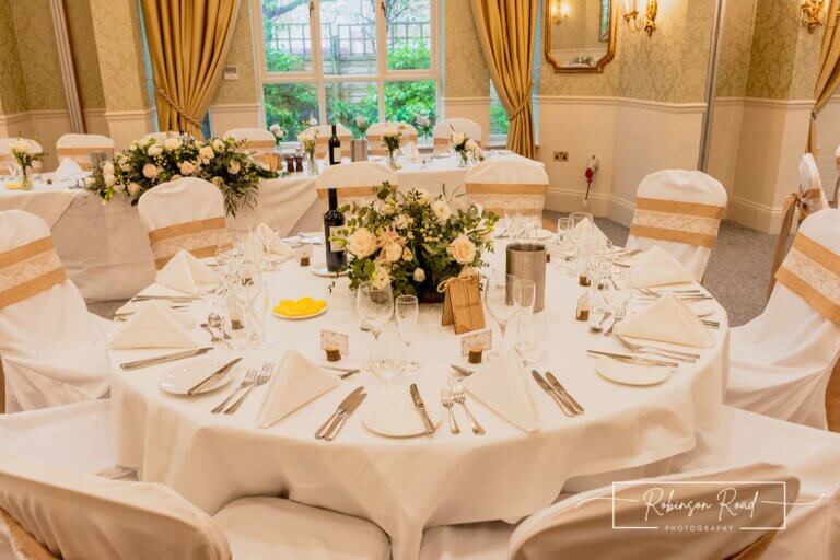 Wedding breakfast tables set ready for guests at Careys Manor Hotel & SenSpa wedding venue in The New Forest