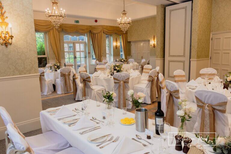 Head table set for wedding breakfast at Careys Manor Hotel & SenSpa wedding venue in The New Forest