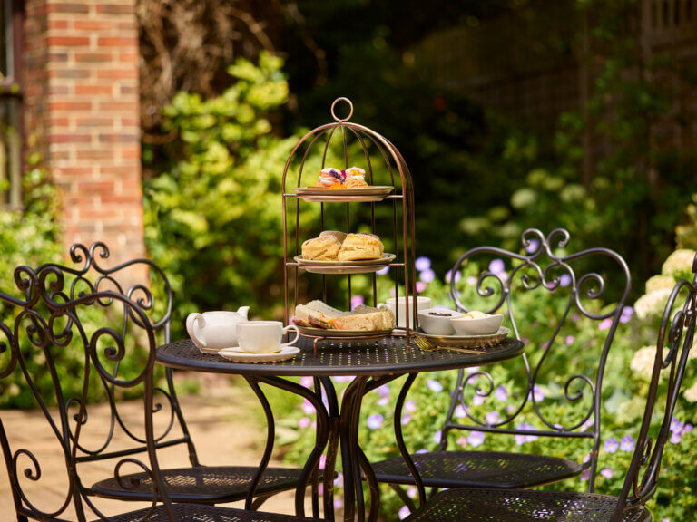 Summer afternoon tea on the terrace in New Forest hotel Careys Manor Hotel & SenSpa