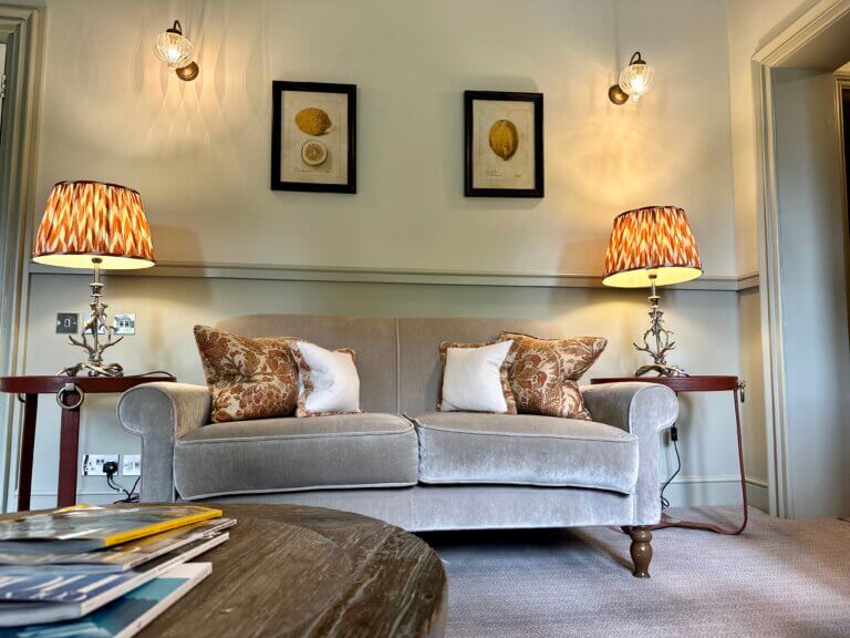 Focus on sofa in lounge area of a bedroom in Careys Manor Hotel & SenSpa in Brockenhurst, The New Forest
