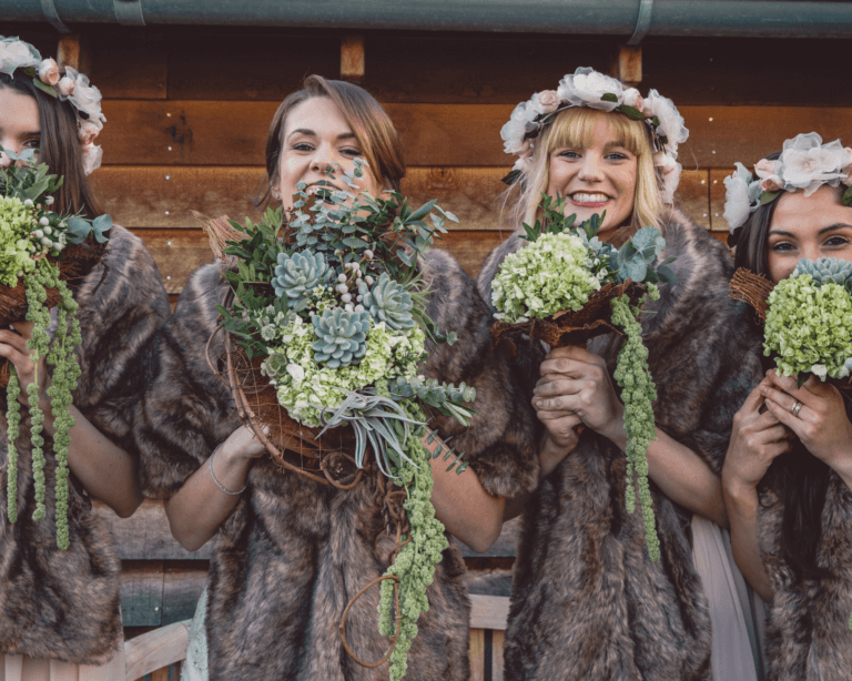 Bridesmaids holding bouquets created by Little Lillies
