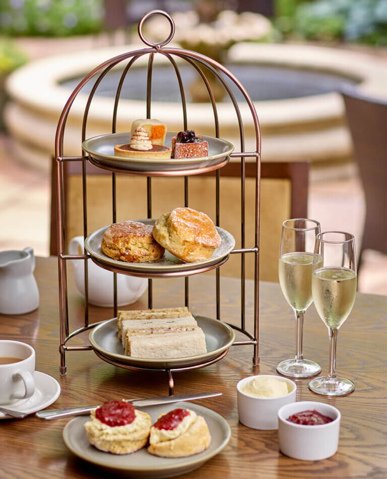 Afternoon Tea on the sunny terrace at Careys Manor Hotel, The New Forest