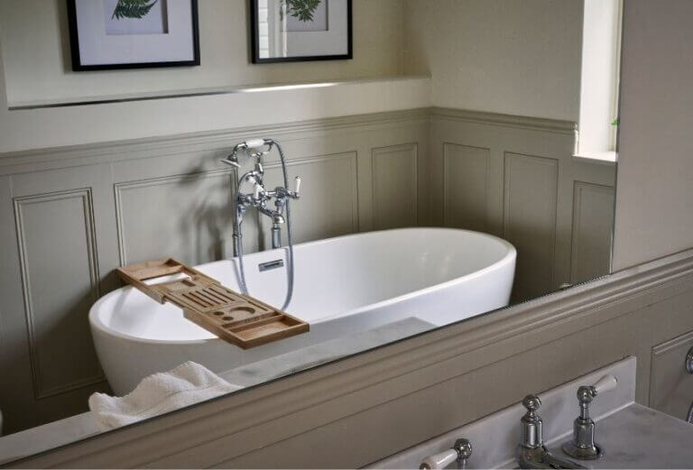 Free standing bath tub in bedroom at Careys Manor Hotel