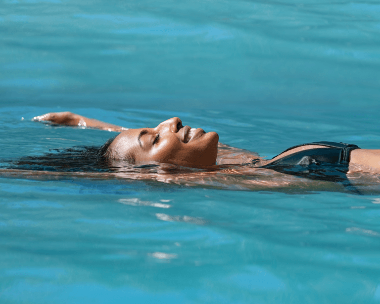 Woman floating in pool